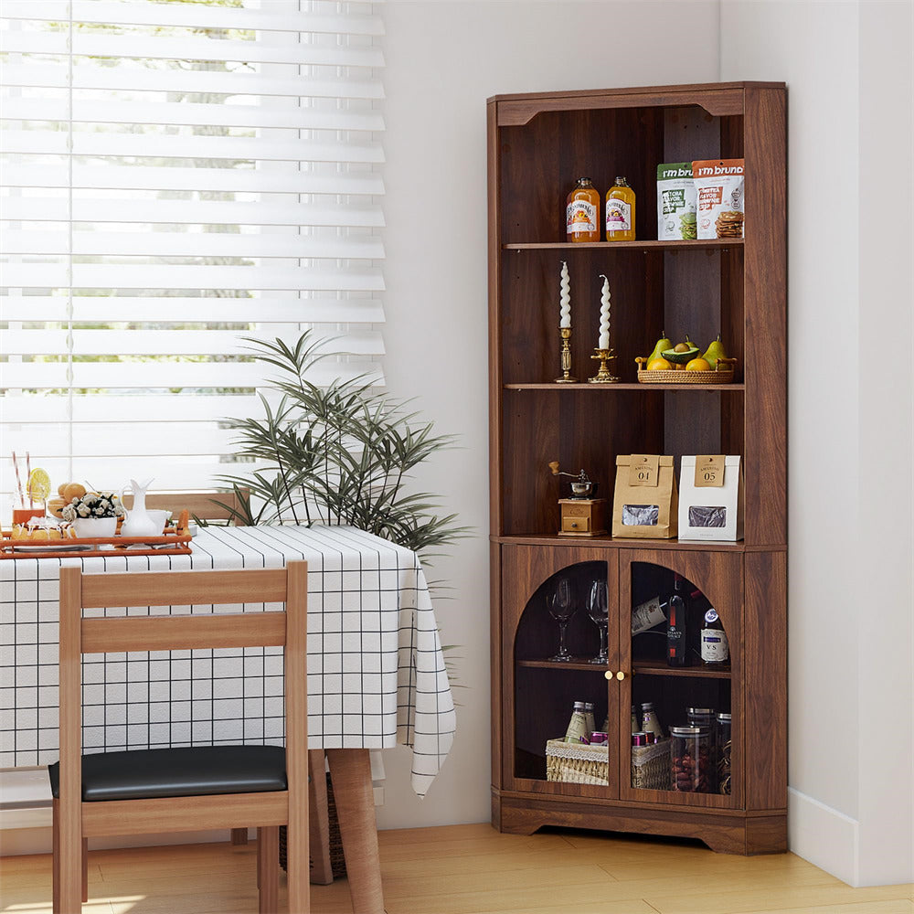 Wooden bookshelf with decorative items in a room with a table and chairs.