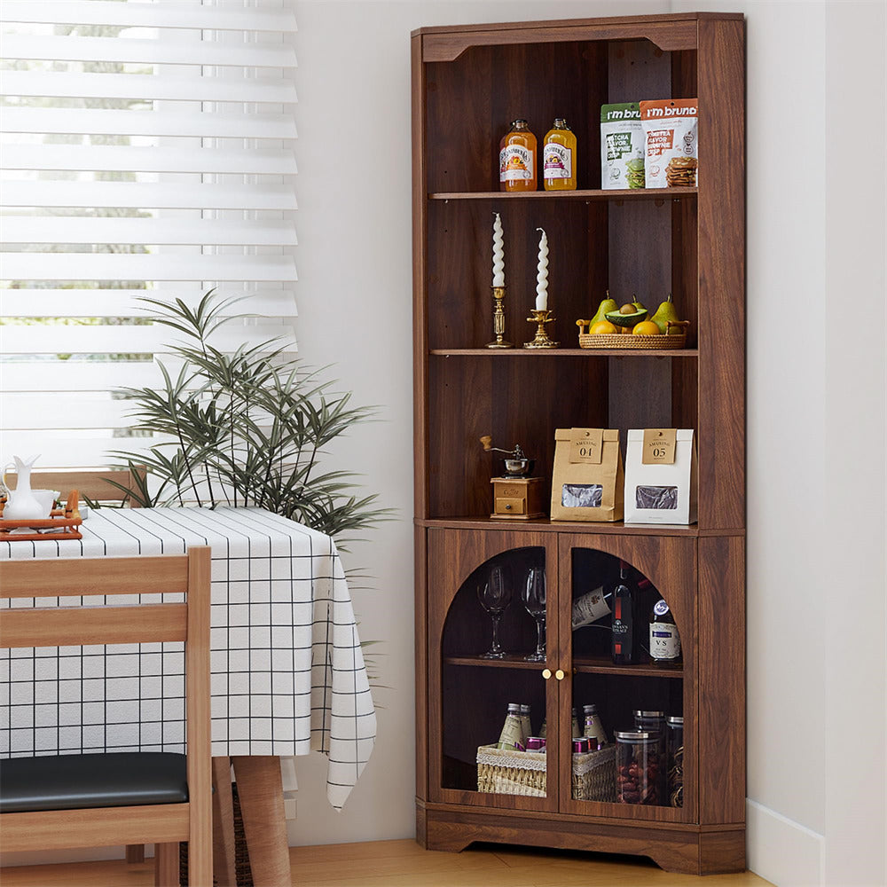Wooden bookshelf with decorative items in a room with a table and plant.