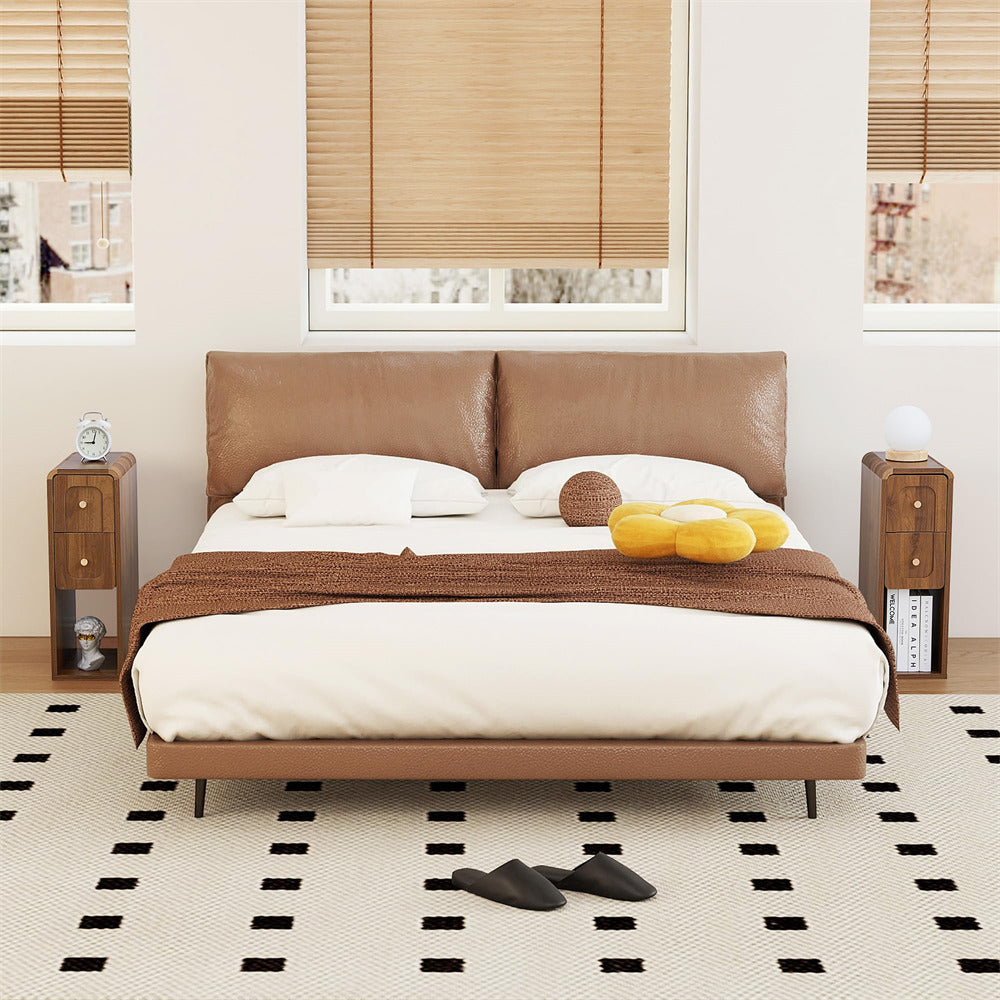 Modern bedroom with a brown leather bed, nightstands, and decor.