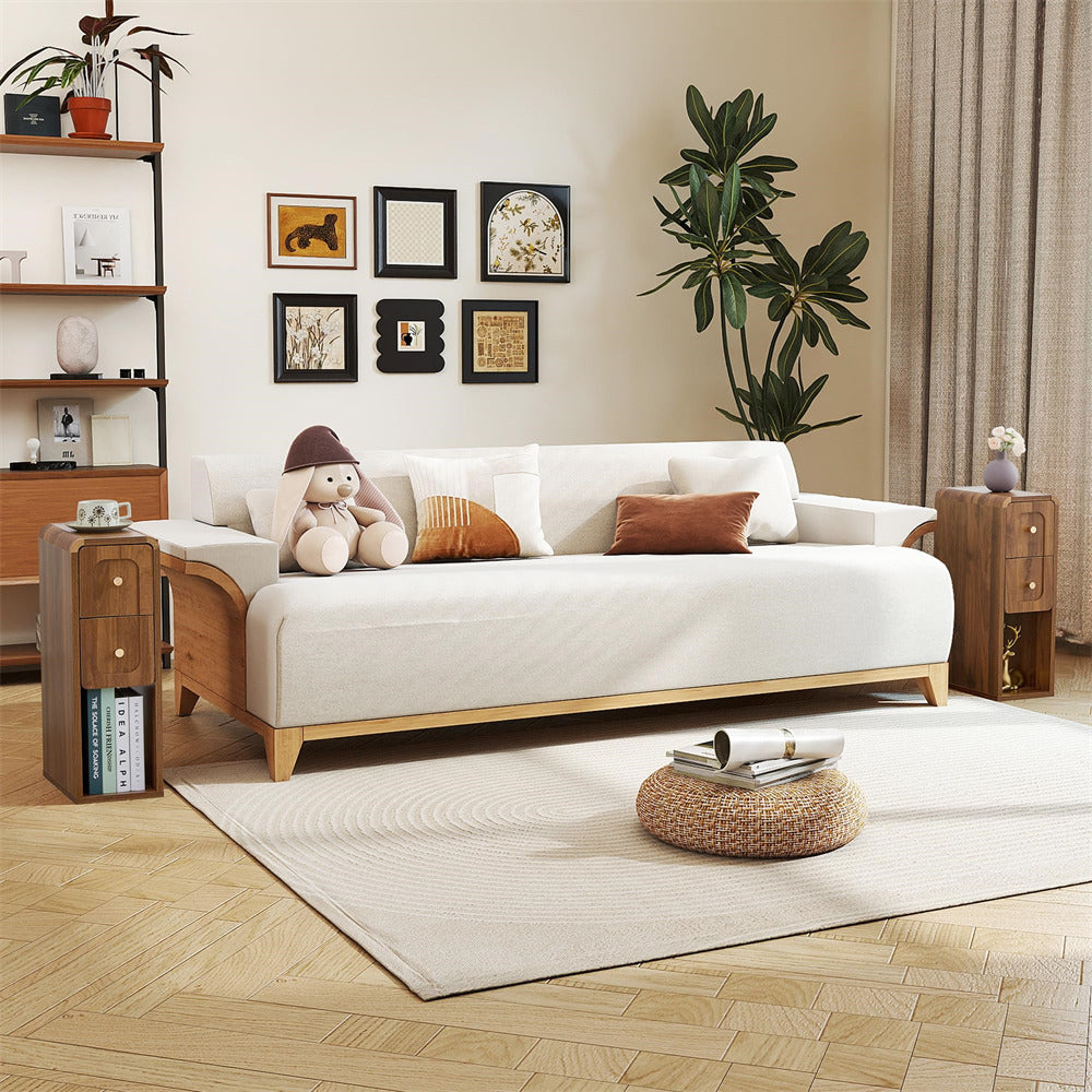 Modern living room with a white sofa, wooden coffee table, and decorative elements.