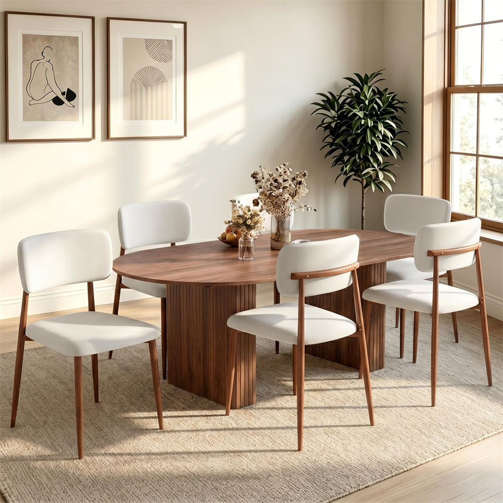 A modern 5-piece dining set featuring a round wooden table and four matching chairs with white upholstered seats and backs, set in a bright, contemporary dining room.