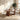 A modern 5-piece dining set featuring a round wooden table and four matching chairs with white upholstered seats and backs, set in a bright, contemporary dining room.