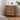 Wooden nightstand with decorative items in a bedroom setting