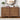 Wooden dresser with decorative items in a bedroom setting