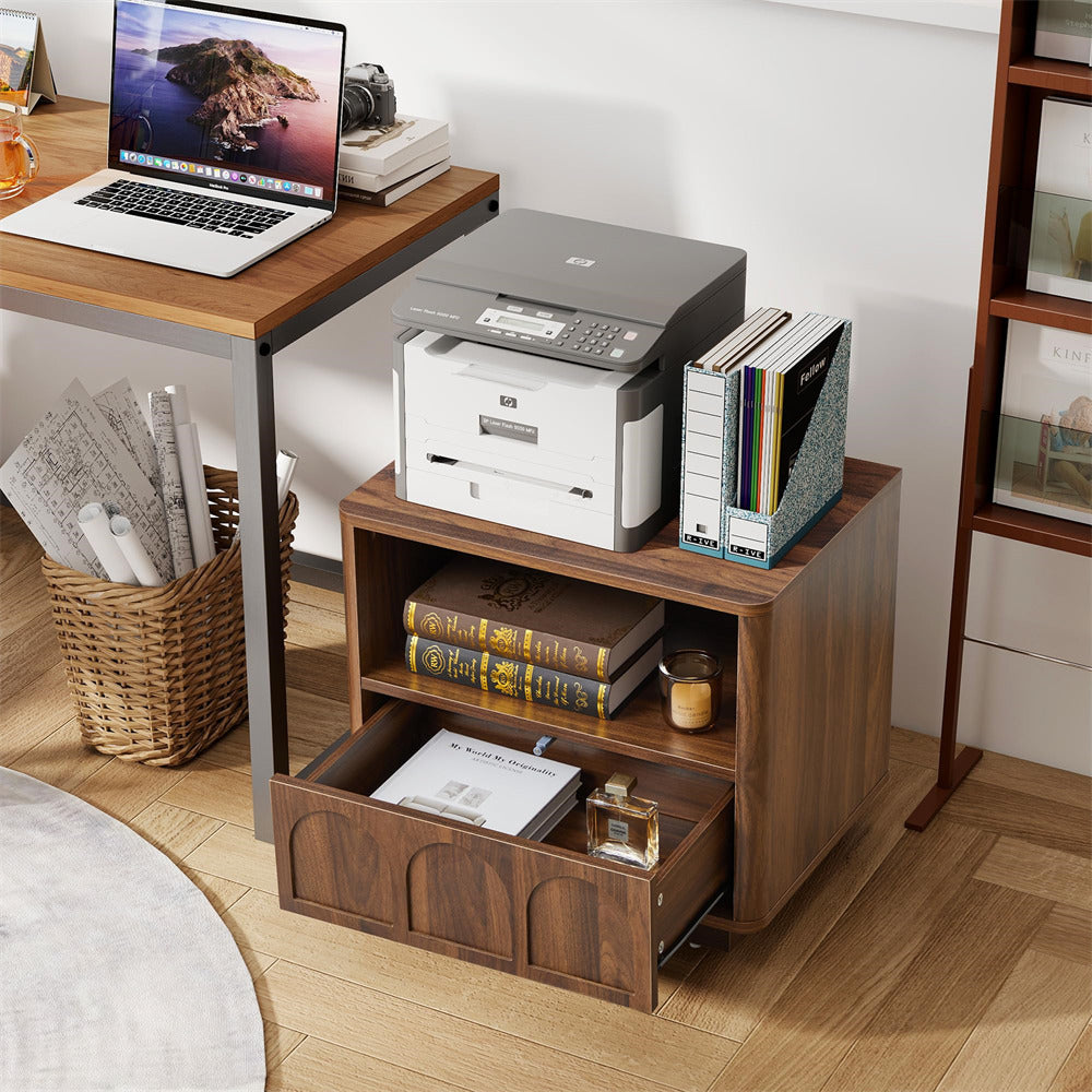 Wooden desk with laptop, printer, and books in a home office setting