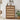 Wooden dresser with woven drawer fronts in a room setting with decor elements.