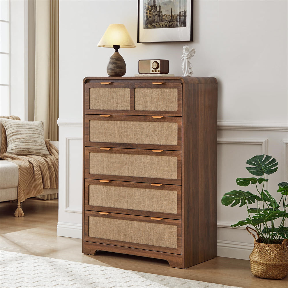 Wooden 5 drawer dressers with fabric-covered drawers in a living room setting.