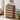 Wooden 5 drawer dressers with fabric-covered drawers in a living room setting.