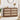Wooden 6 drawer dressers with decorative items in a room setting