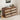 Wooden dresser with fabric drawers in a room setting