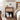 Wooden nightstand with decorative items in a bedroom setting