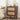 Wooden nightstand with two drawers in a bedroom setting