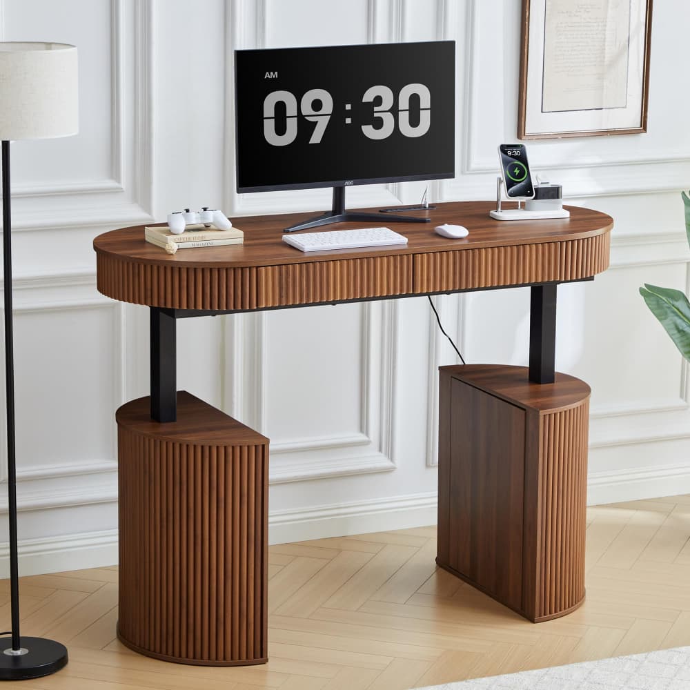 A modern wooden computer desk with a slatted ribbed design and black metal legs, styled in a bright home office setting with a computer, keyboard, and other desk accessories.