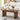 Wooden coffee table with decor items in a living room setting