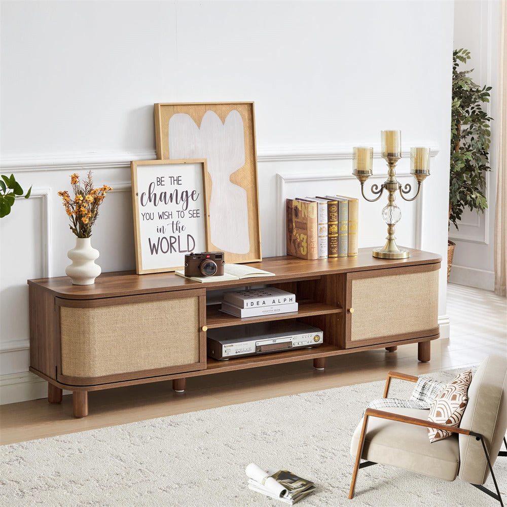 Wooden entertainment console in a living room with decor items.