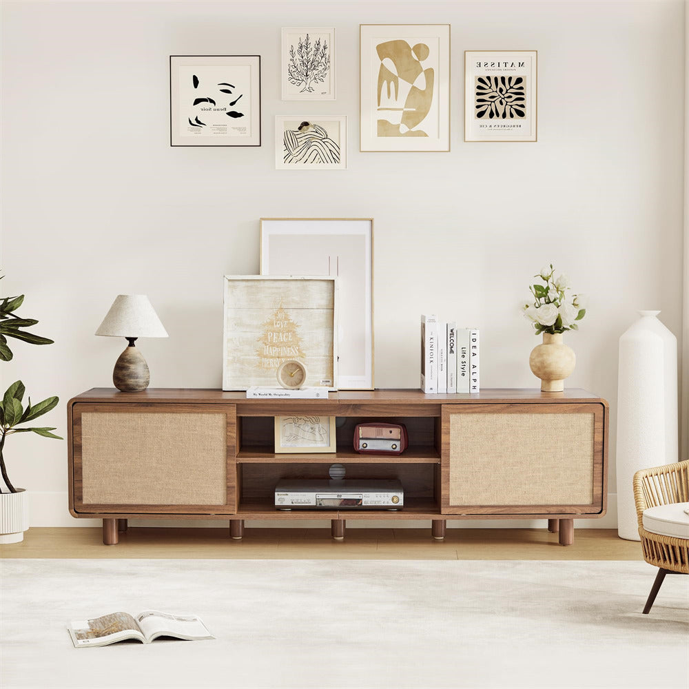 Wooden TV stand with decorative items in a living room setting