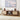 Wooden TV stand with speakers and decor items in a living room setting.