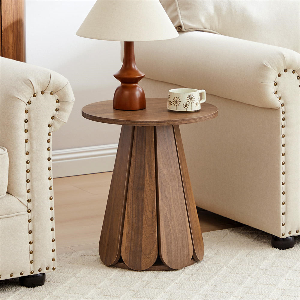 Wooden side table with a lamp and mug in a living room setting