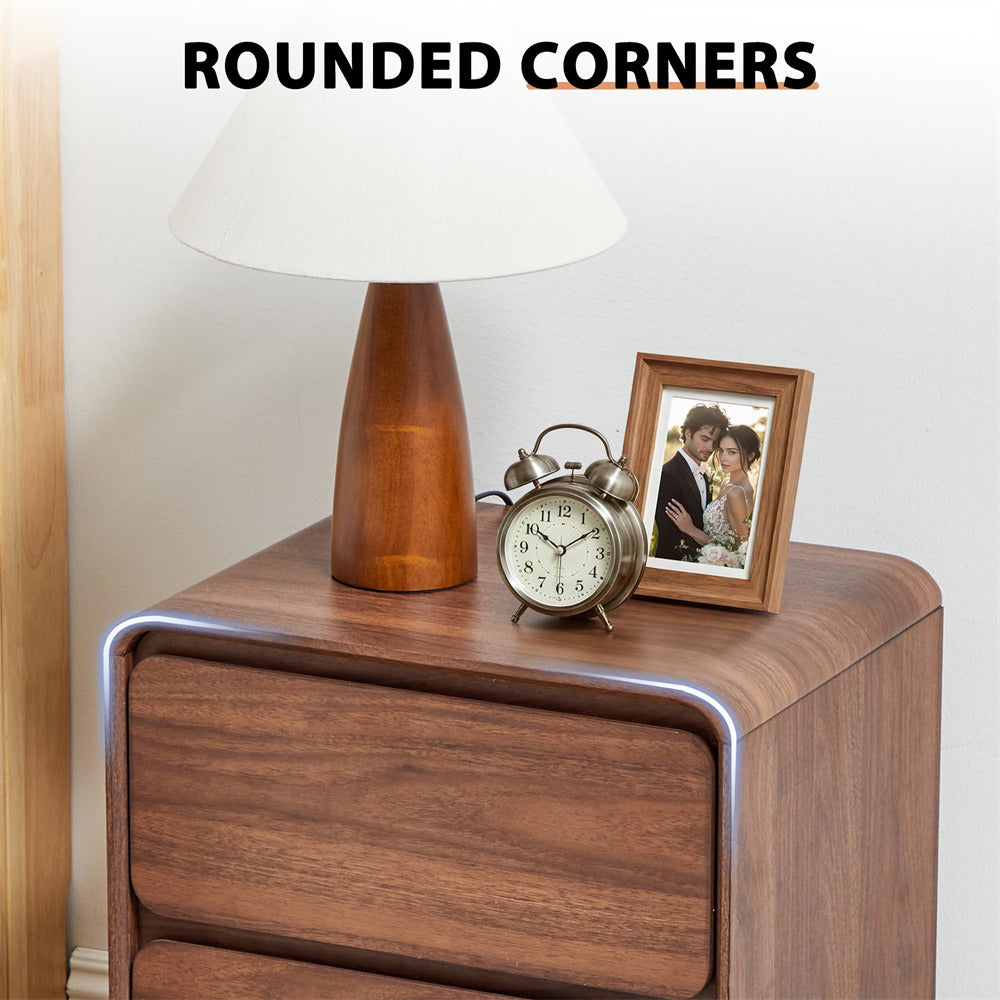 Wooden nightstand with lamp, clock, and photo frame on a white background