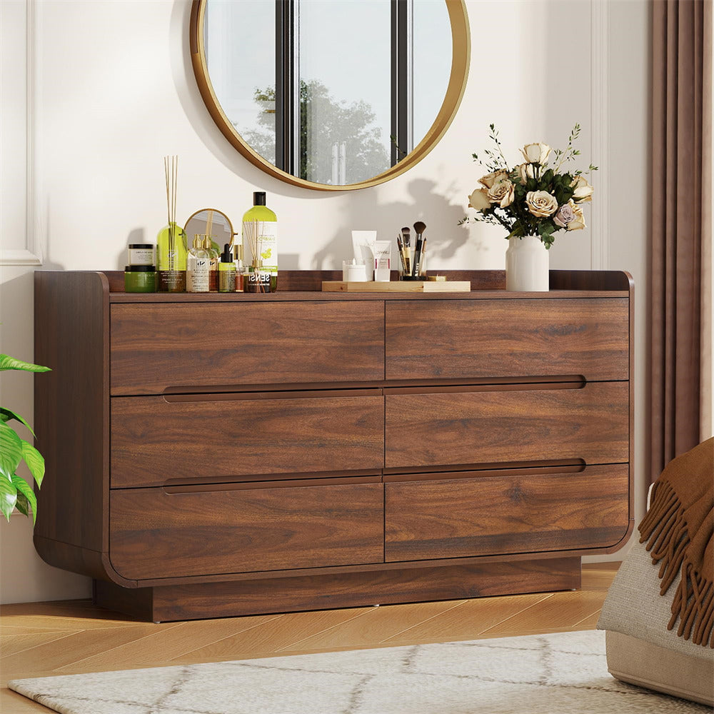 Wooden 6-drawer dresser with decorative items in a room setting