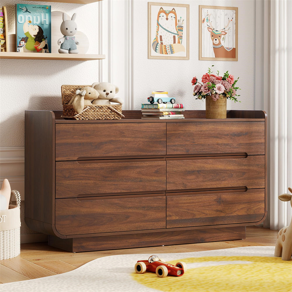 Wooden 6-drawer dresser in a child's room with toys and decor
