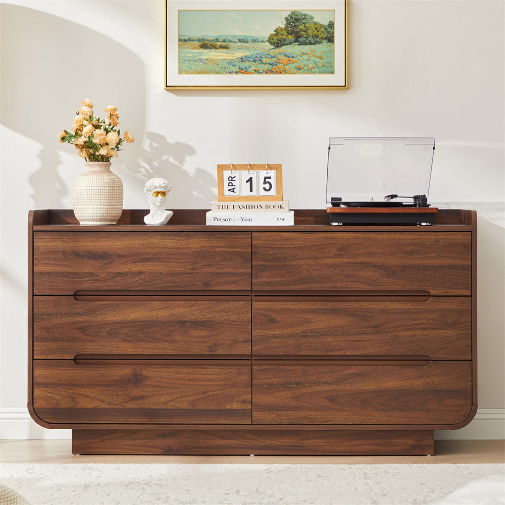 Wooden 6-drawer dresser with decorative items in a room setting