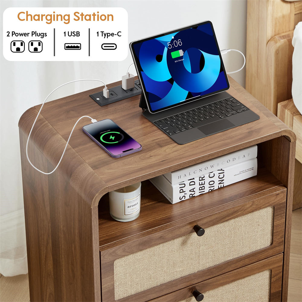 Wooden charging station with laptop, phone, and books on a wooden surface.