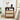 Wooden nightstand with decorative items in a bedroom setting