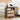 Wooden nightstand with two drawers, top charging station, and cable hole in a living room setting.