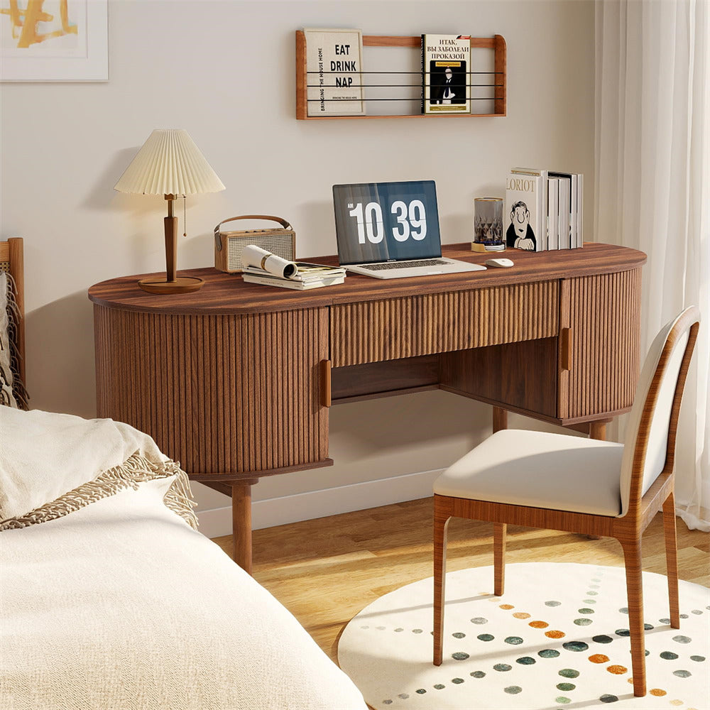 Wooden desk in a bedroom with a chair and decor items.