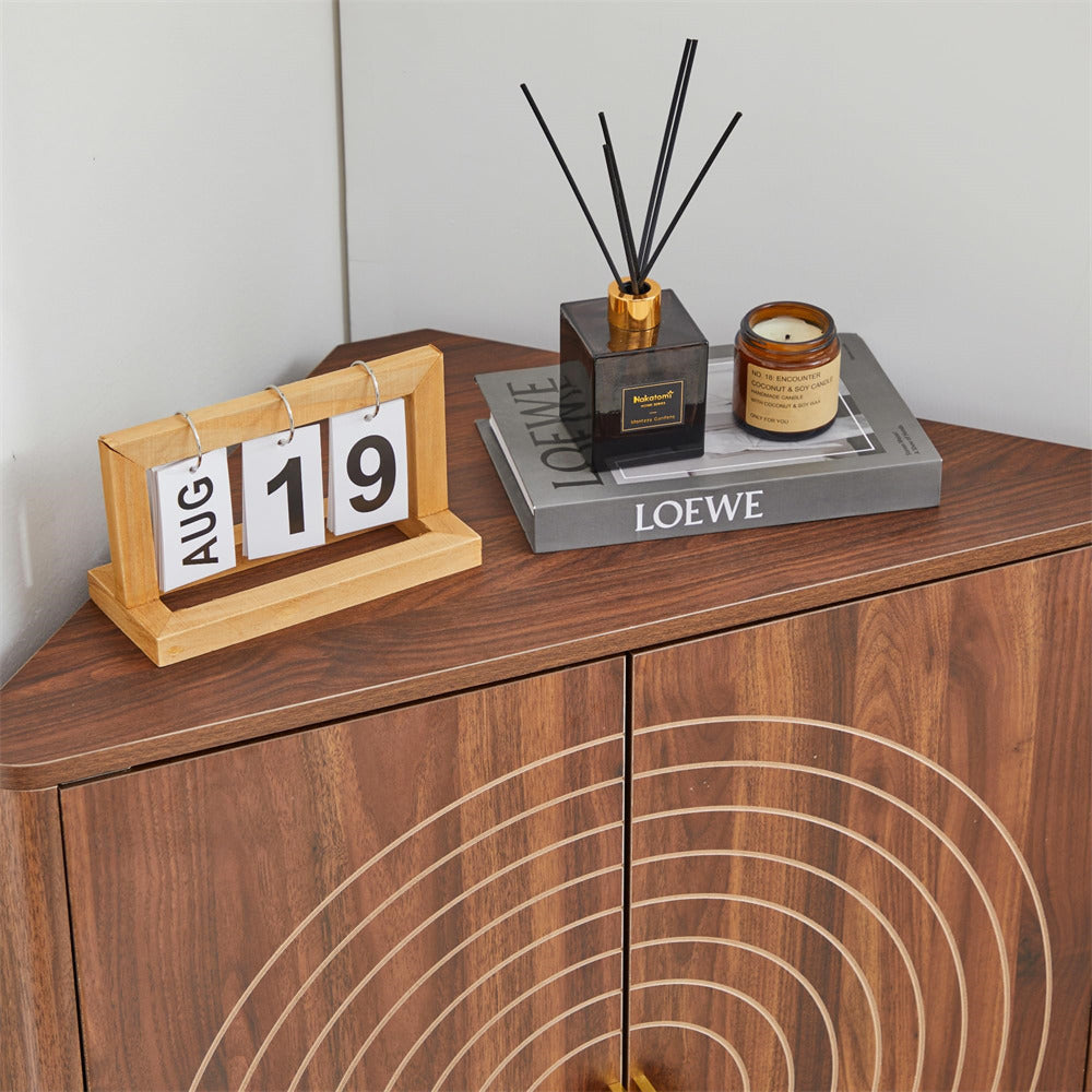 Decorative items on a wooden surface including a calendar, diffuser, and candle with a Loewe book.