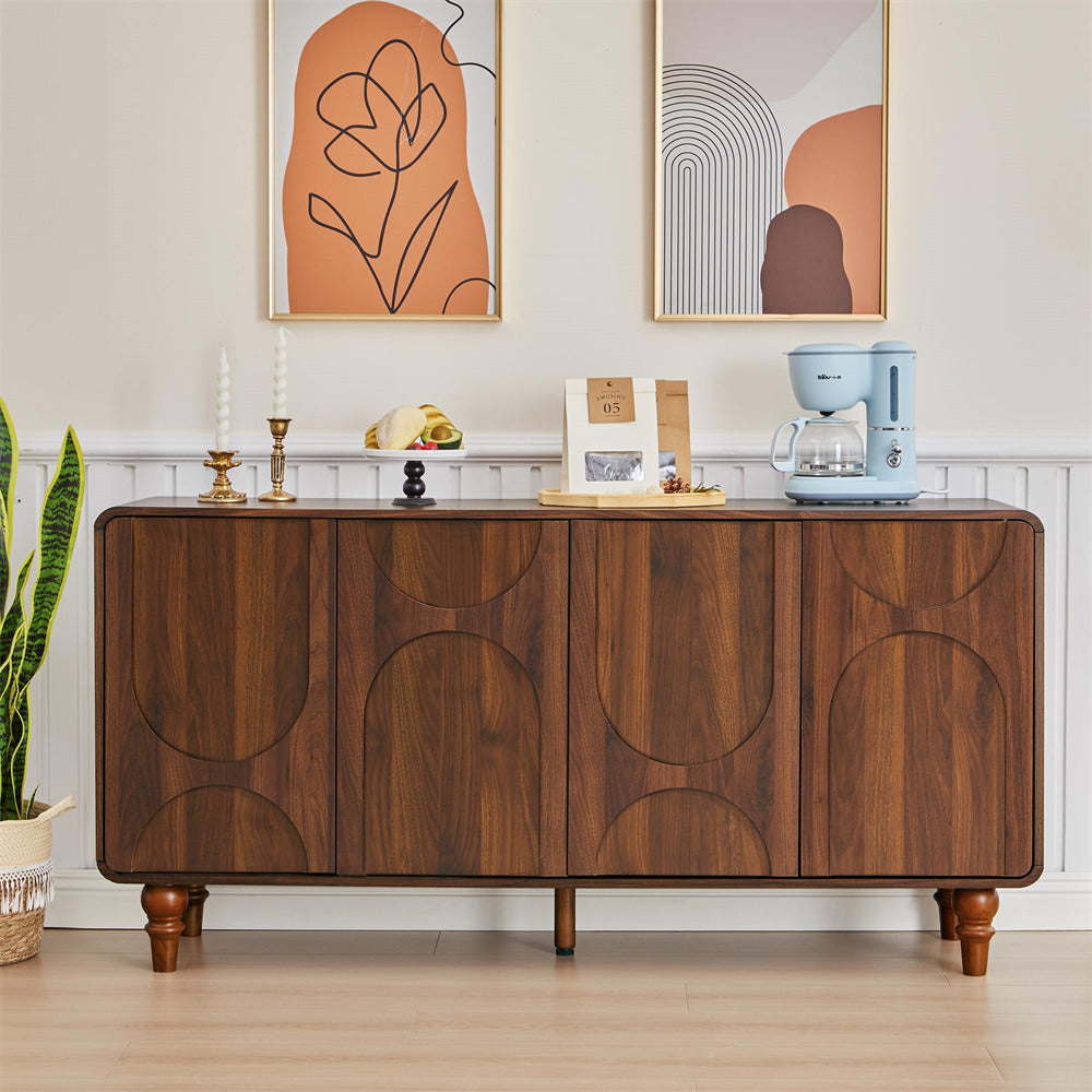 Wooden sideboard with decorative items in a room with abstract wall art.