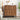 Wooden dresser with decorative items in a bedroom setting