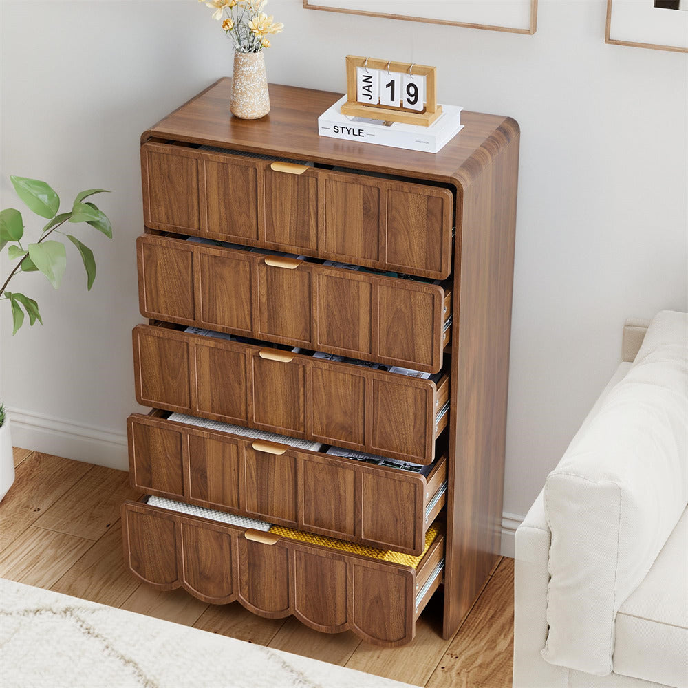 Wooden 5 drawer dresser with multiple drawers in a bedroom setting