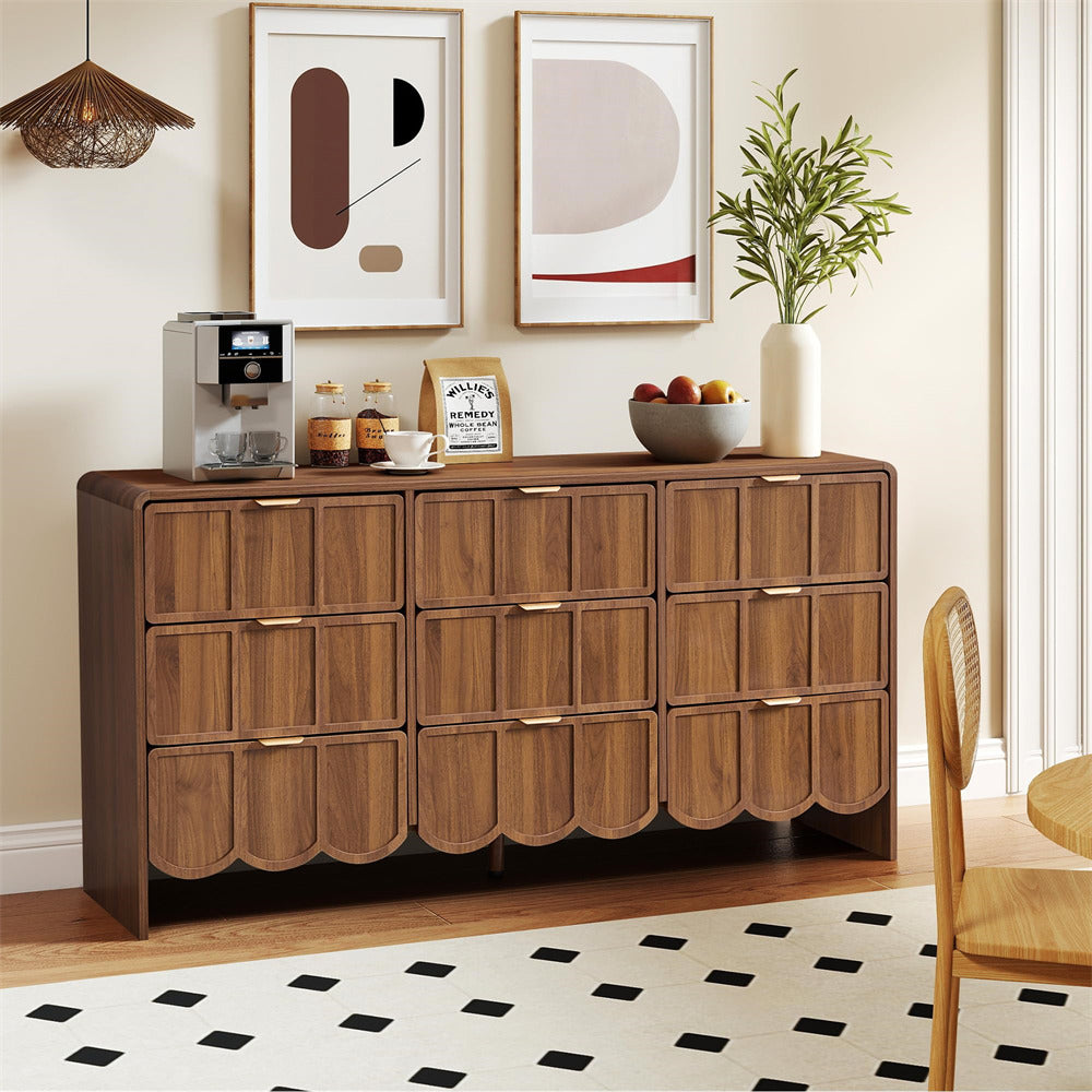 Wooden 9 drawer dresser with decorative items in a room with abstract art and a plant.