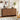 Wooden 9 drawer dresser with decorative items in a room with abstract art and a plant.