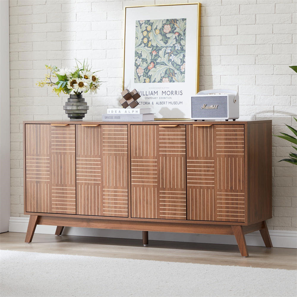 Wooden sideboard with decorative items against a white brick wall.