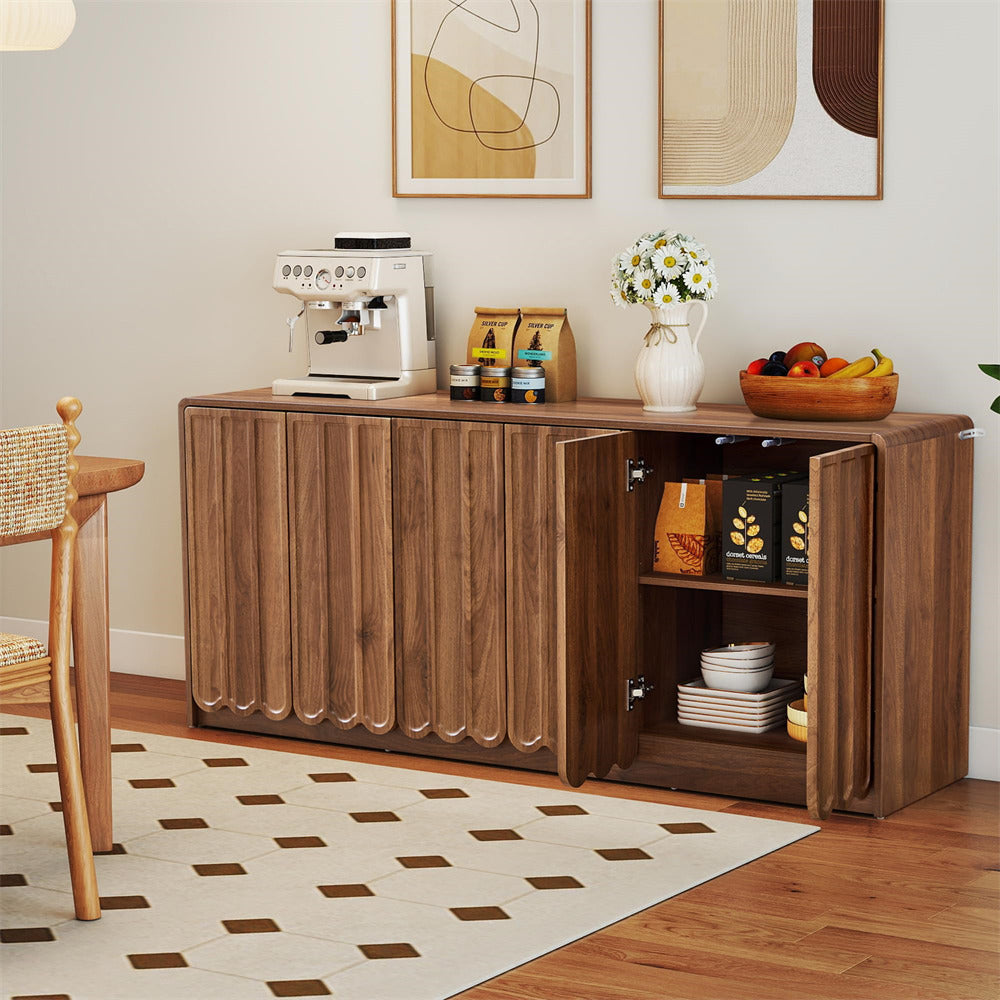 Wooden sideboard with coffee station setup in a room with abstract art on the wall.