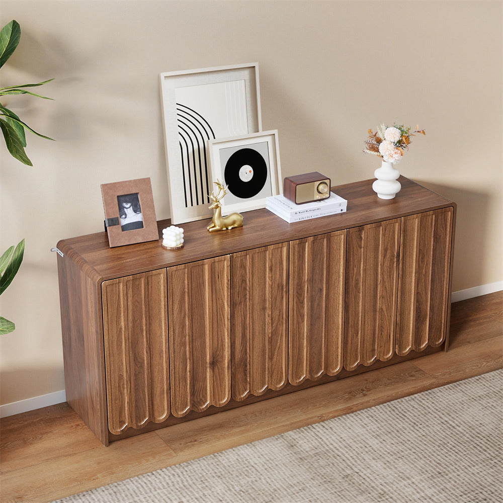 Wooden sideboard with decorative items against a beige wall