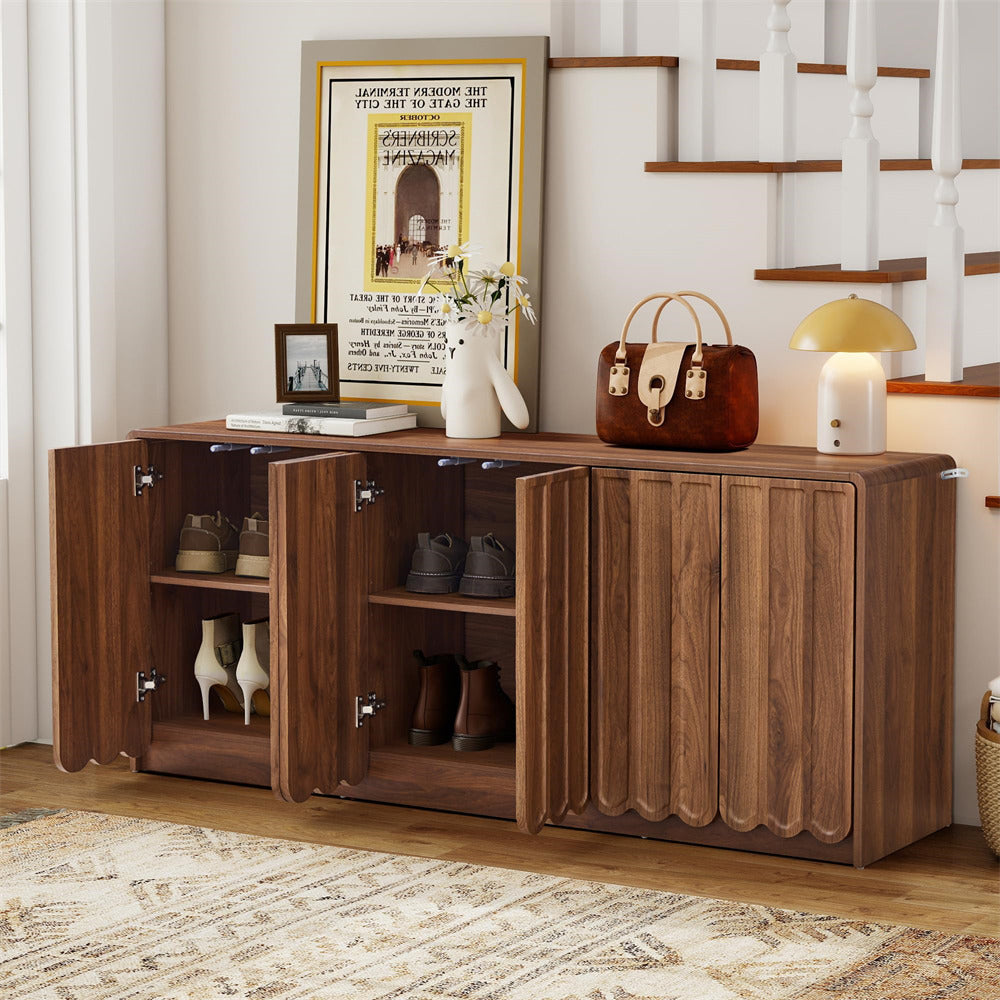 Wooden sideboard with open doors in a room with a staircase and decor items.