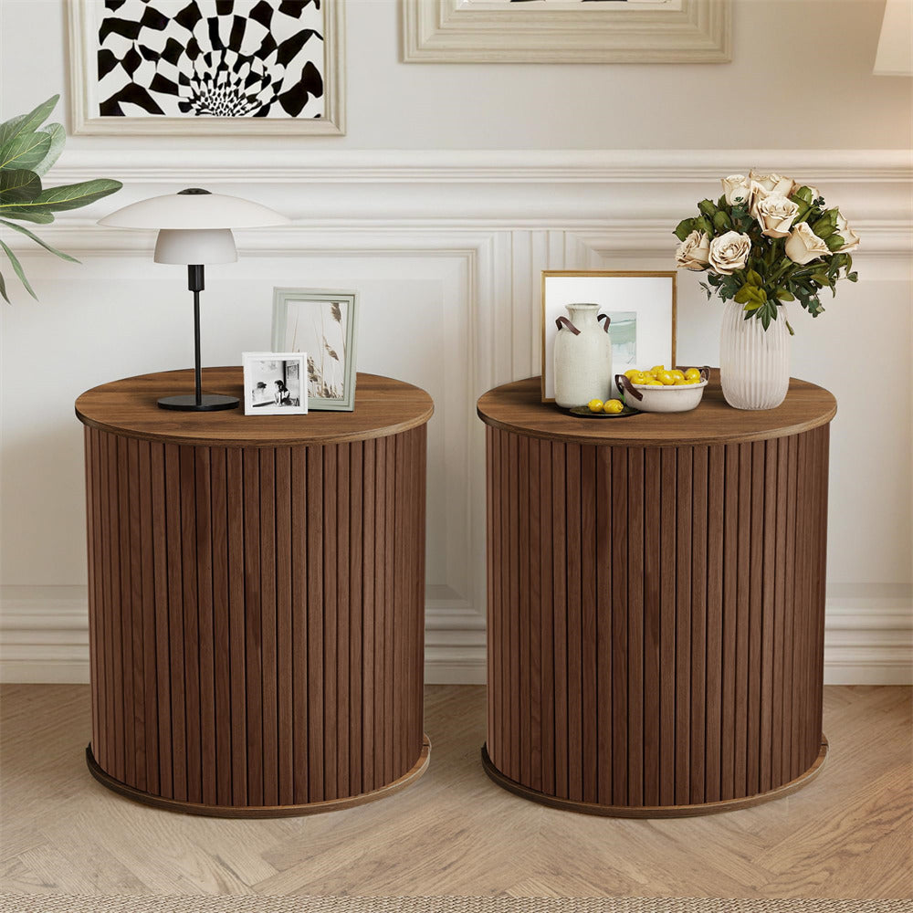 Two wooden side tables with decorative items in a living room setting.