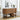 Wooden console table with decorative items in a room with a window and plant.