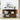Wooden shelf with books, a suitcase, and decorative items in a room with a plant and framed pictures on the wall.