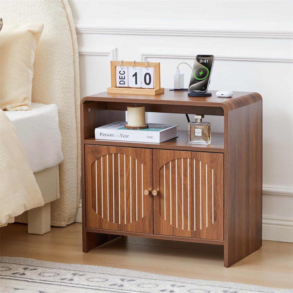 Wooden nightstand with decorative items in a bedroom setting