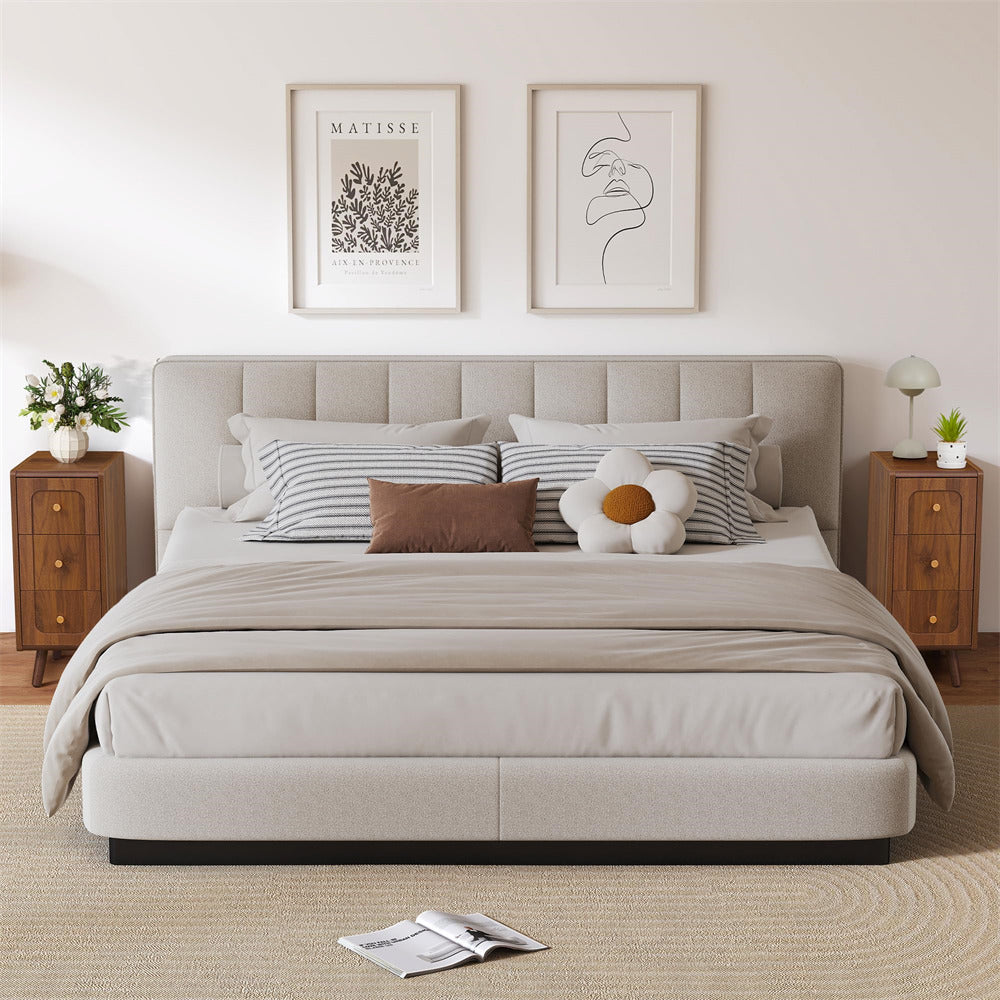 Neatly made bed with pillows and a blanket in a bedroom setting.