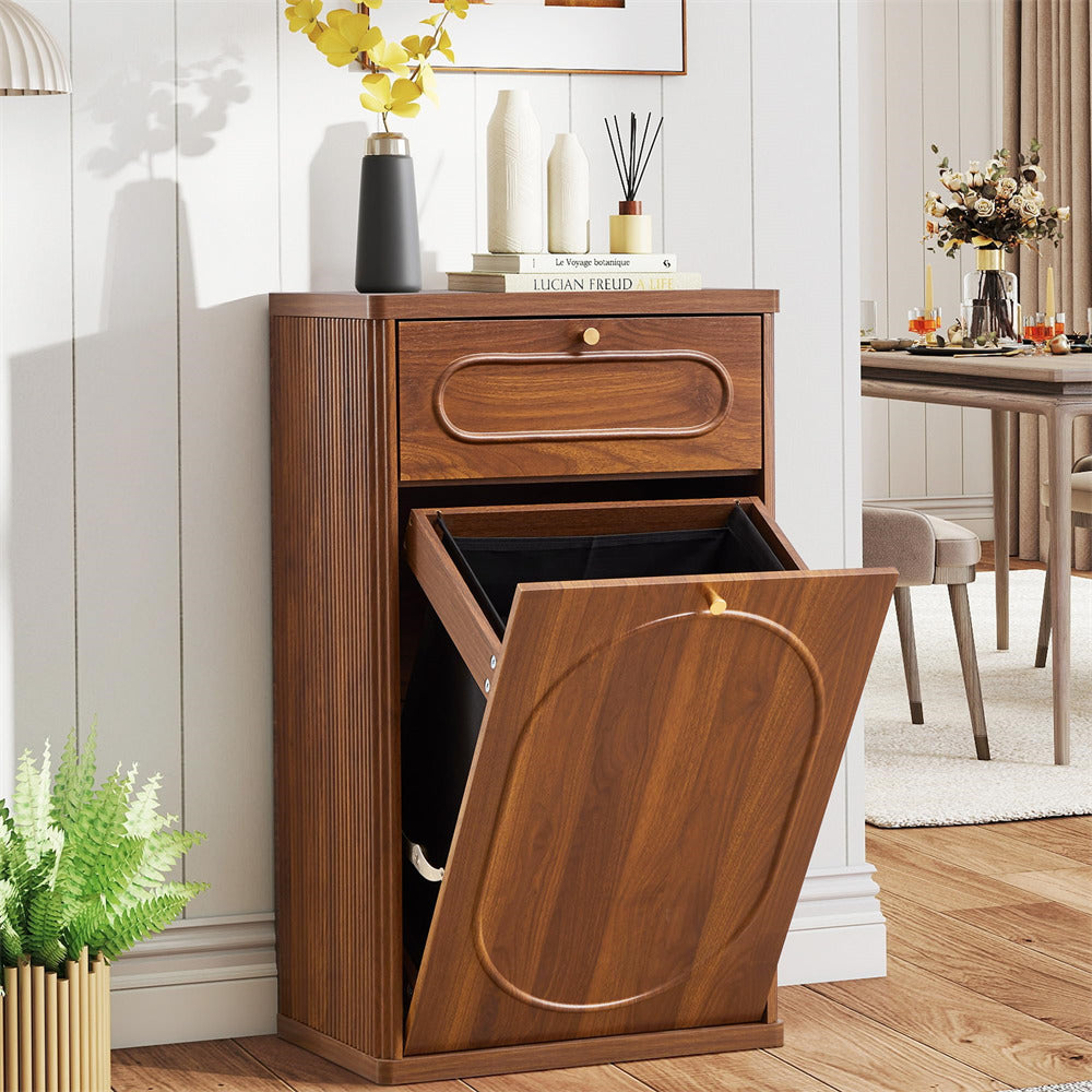 Wooden trash bin with pull-out lid in a room with decor elements.