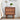 Wooden walnut nightstand with decorative carvings in a bedroom setting