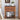 Wooden nightstand with decorative items in a bedroom setting