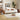 A modern wooden daybed with a white upholstered seat, styled in a warm, contemporary living room with a white rug, wooden floor, and wall art.