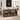Wooden storage cabinet with glass doors in a kitchen setting, featuring various items on top.